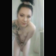 A brunette, Scottish girl takes a shit and a piss while standing in a shower. She picks up her turd and shows it off to the camera. Vertical format video. Over 7 minutes.